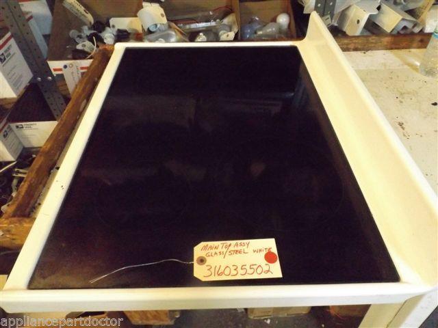 FRIGIDAIRE STOVE 316035502 MAIN TOP ASSY. GLASS/STEEL WHITE USED FRIGIDAIRE STOVE 316035502 MAIN TOP ASSY. GLASS/STEEL WHITE USED
